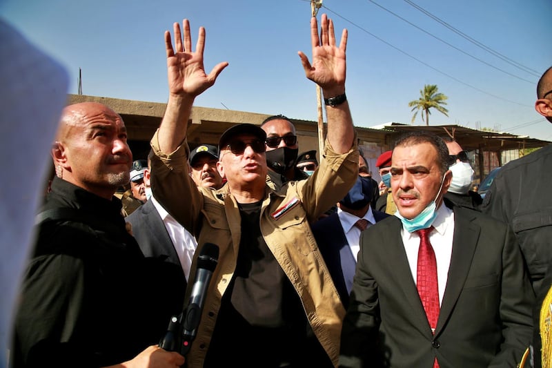 Iraqi Prime Minister Mustafa al-Kadhimi speaks to locals in Tarmiyah, Iraq July 20, 2020. Khalid Mohammed/Pool via REUTERS