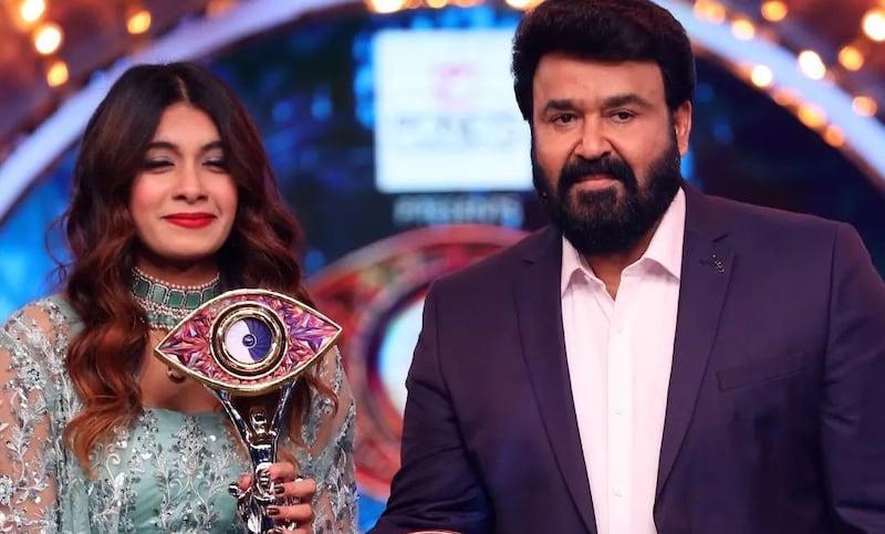 Dancer Dilsha Prasannan, seen here with actor and host Mohanlal, has been crowned the winner of 'Bigg Boss Malayalam' season four. All photos: Asianet