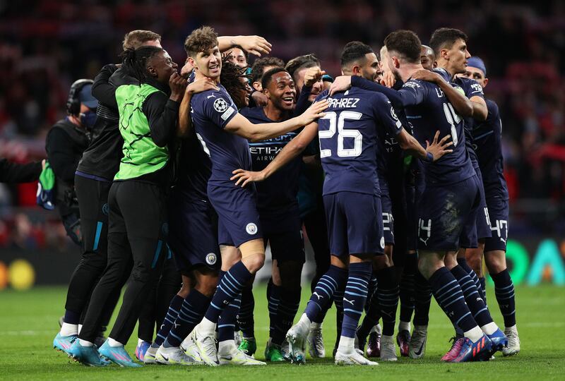 Manchester City players celebrate at the final whistle. Getty