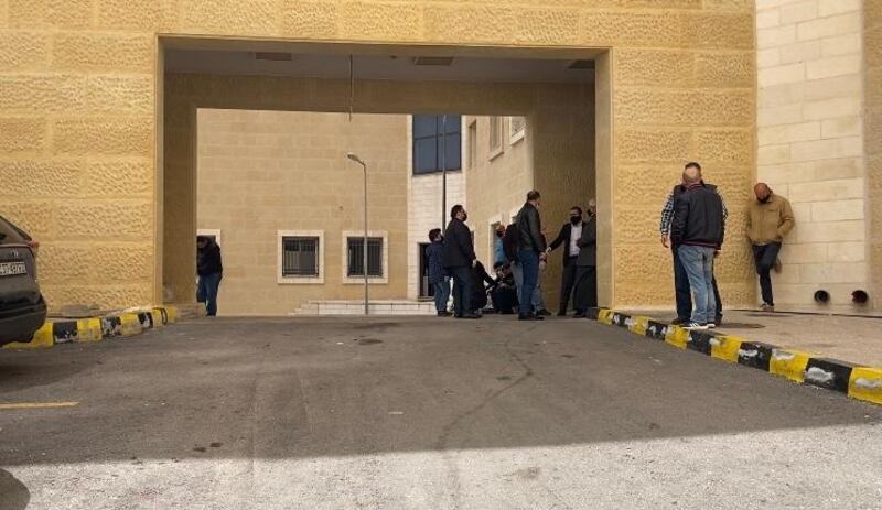 Families of the victims wait outside the morgue to collect the bodies of their loved ones. 