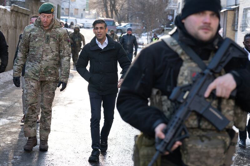 Mr Sunak and Vice Chief of the Defence Staff, Maj Gen Gwyn Jenkins, on a tour of damaged buildings in Kyiv. Reuters