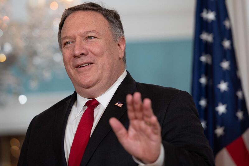 (FILES) In this file photo taken on August 21, 2018, US Secretary of State Mike Pompeo waves to the media at the State Department in Washington, DC. - The US appears resigned to the likelihood of a final military victory by Syrian government forces, even as it warns Bashar al-Assad and Moscow against launching a major offensive in the rebel-held northwest, analysts say. Pompeo on August 31, 2018, accused his Russian counterpart Sergey Lavrov of "defending" the expected assault by Russian-backed Syrian forces on Idlib province, (Photo by SAUL LOEB / AFP)