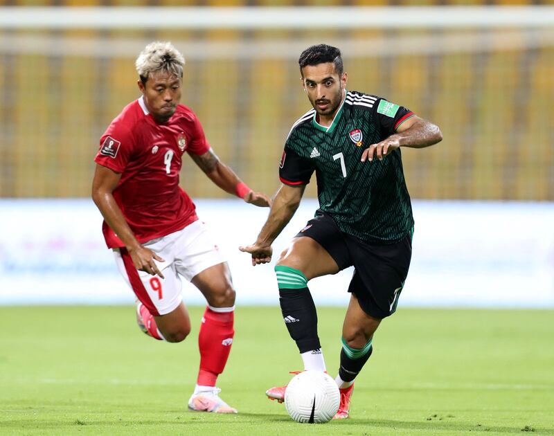 Ali Mabkhout of the UAE tussles with Kushedya Hari Yudo of Indonesia in the World Cup qualifier at the Zabeel Stadium, Dubai. Chris Whiteoak / The National