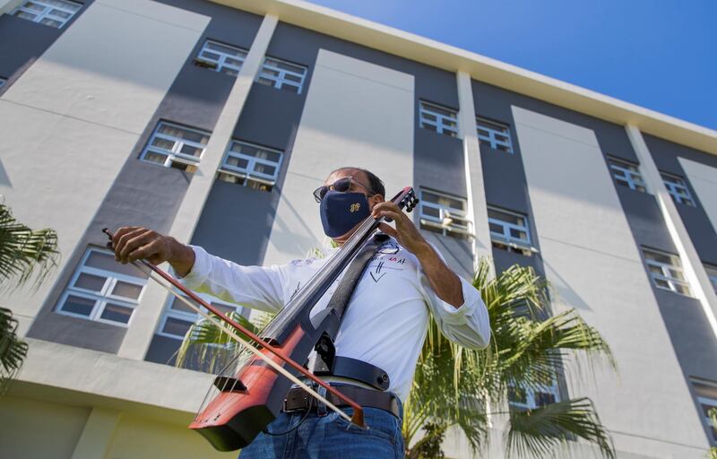 Pablo Polanco performs with his electric cello for medical personnel and patients at the Hugo Mendoza paediatric hospital in Santo Domingo, Dominican Republic. EPA