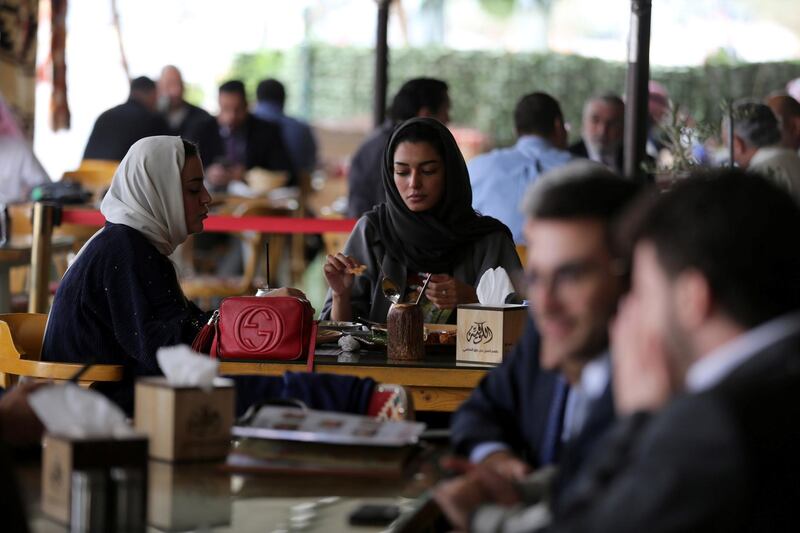 Saudi men and women sit at cafe in Riyadh. Reuters