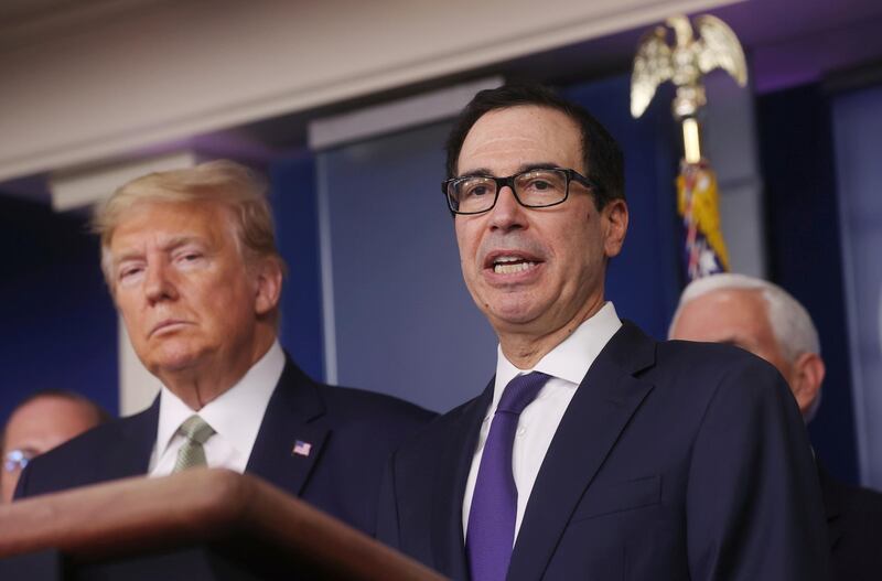 FILE PHOTO: U.S. President Donald Trump and Treasury Secretary Steven Mnuchin answer questions during the Trump administration?s daily coronavirus briefing at the White House in Washington, U.S., March 17, 2020. REUTERS/Jonathan Ernst/File Photo