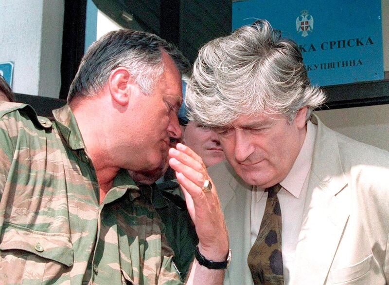 Republika Srpska leader Radovan Karadzic (R) listens to VRS Commander Ratko Mladic (L) during a meeting in Pale, Bosnia and Herzegovina, August 05, 1993. EPA