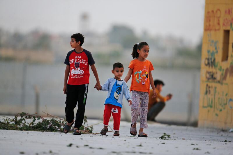 Children play at the border between Turkey and Syria, in Akcakale. AP Photo