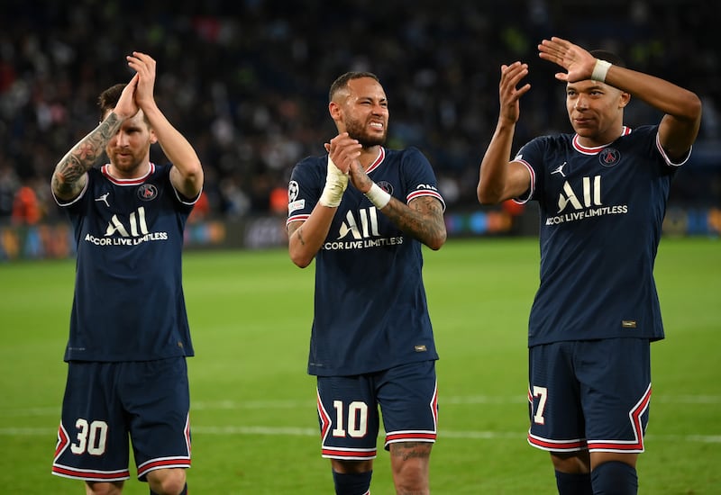 Lionel Messi, Neymar and Kylian Mbappe of Paris Saint-Germain applaud the fans. Getty