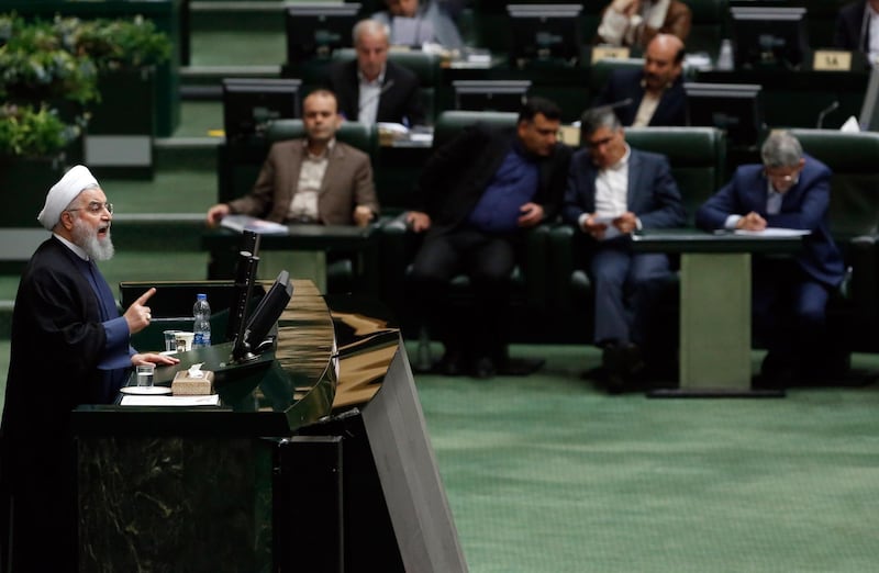 epaselect epa06977963 Iranian President Hassan Rouhani (L) speaks during the Parliament session at the Iranian Parliament, in Tehran, Iran, 28 August 2018, to answer lawmakers about the recent local and foreign crisis currently affecting the country.  Media reported that President Rouhani is under pressure because of the economic crises and demands for his resignation have increased. Rouhani defended his foreign and economic policy, but the parliament voted that they were not satisfied by the President's response.  EPA/ABEDIN TAHERKENAREH