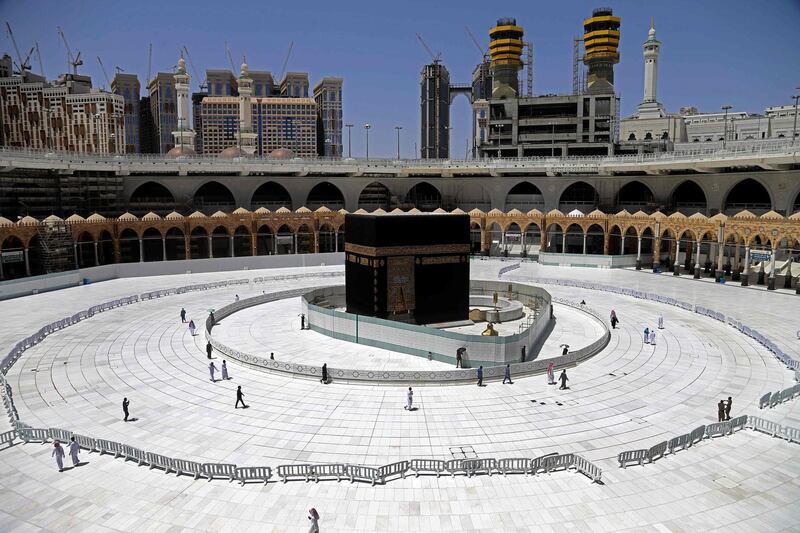TOPSHOT - Muslim worshippers circumambulate the sacred Kaaba in Mecca's Grand Mosque, Islam's holiest site, on April 3, 2020. Saudi Arabia on April 2 extended curfew restrictions on Islam's two holiest cities to 24 hours to stem the spread of coronavirus as the number of deaths from the disease rose to 21. / AFP / -
