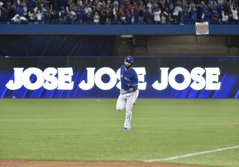 Toronto Blue Jays player Jose Bautista rounds the bases after his eventually game-winning home run on Wednesday night against the Texas Rangers in the MLB play-offs. Nathan Denette / The Canadian Press / AP