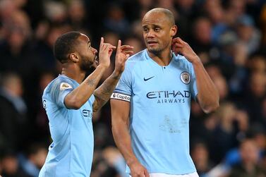 Raheem Sterling, left, scored all three of Manchester City's goals against Watford, leading to huge praise from captain Vincent Kompnay, right. Getty