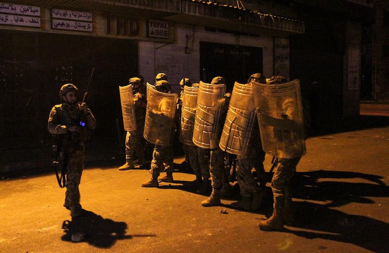 Army soldiers are deployed during clashes with demonstrators at a protest against the lockdown and worsening economic conditions, amid the spread of the coronavirus disease (COVID-19), in Tripoli, Lebanon. Reuters