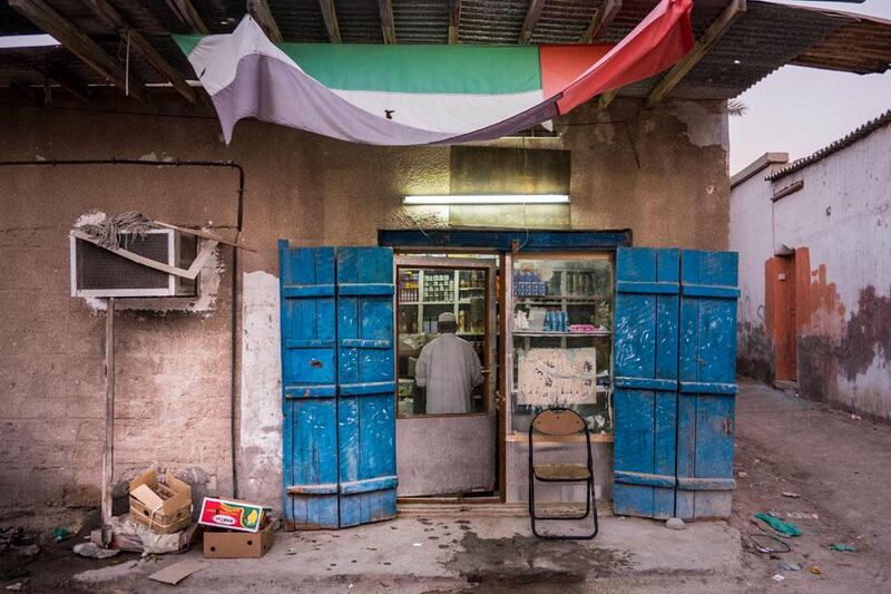 Mohammed Khasan stands in the doorway of the shop he has been running  
for more than 40 years in the old neighbourhood.