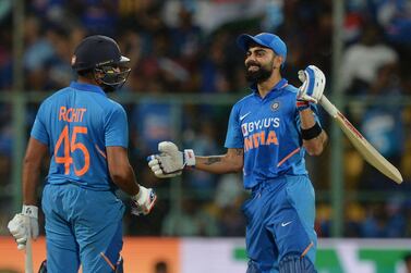 India's captain Virat Kohli (R) and Rohit Sharma greet each other during the third and last one day international (ODI) cricket match of a three-match series between India and Australia at the M. Chinnaswamy Stadium in Bangalore on January 19, 2020. India is chasing a target of 287 runs set by Australia with a loss of 9 wickets. - ----IMAGE RESTRICTED TO EDITORIAL USE - STRICTLY NO COMMERCIAL USE----- / GETTYOUT / AFP / Manjunath KIRAN / ----IMAGE RESTRICTED TO EDITORIAL USE - STRICTLY NO COMMERCIAL USE----- / GETTYOUT