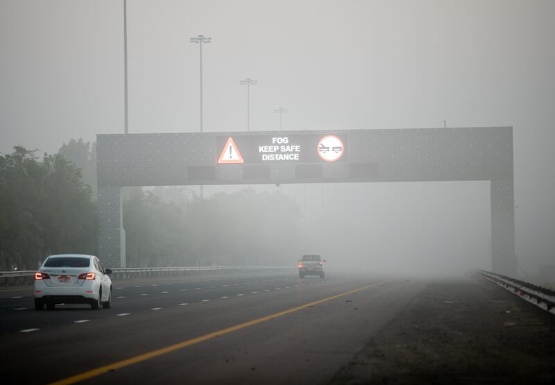 Visibility is greatly reduced on the E11 Highway in Abu Dhabi. Victor Besa / The National