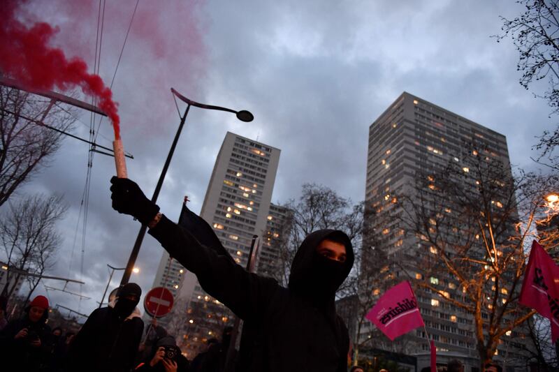 Protesters march during a demonstration near Place d'Italie in Paris. AFP