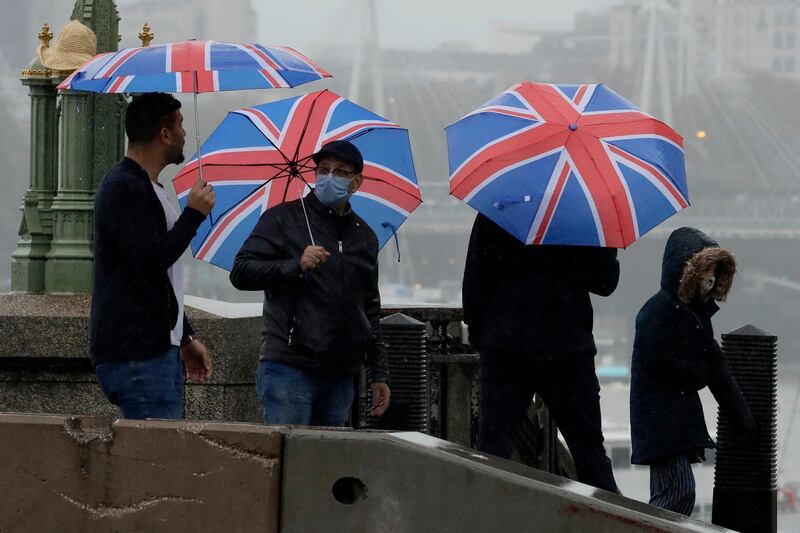British union flag umbrellas on Westminster Bridge in central London. AP Photo