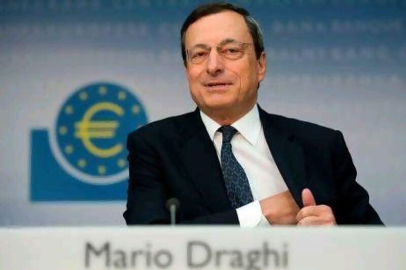 Mario Draghi, the ECB president, addresses the media in Frankfurt yesterday after the bank cut its growth forecast for the euro zone. Johannes Eisele / AFP