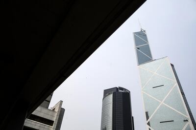The Bank of China Tower, right, stands in Hong Kong, China, on Wednesday, March 30, 2016. Bank of China Ltd., the nation's fourth-largest lender, reported a 0.7 percent increase in 2015 profit as fee and commission income grew. Photographer: Justin Chin/Bloomberg via Getty Images