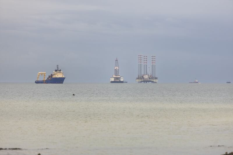 Oil rigs in the waters off Gabon. The International Energy Agency expects oil demand to surge to record levels this year. Bloomberg