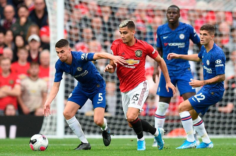 Pereira, right, looks to win the ball back Jorginho. AFP