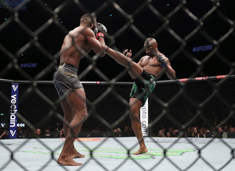 Kamaru Usman aims a high kick at Leon Edwards during their welterweight title bout at UFC 286. PA