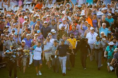 May 23, 2021; Kiawah Island, South Carolina, USA; Phil Mickelson and caddie Tim Mickelson walks though the crowd of fans on the 18th hole during the final round of the PGA Championship golf tournament. Mandatory Credit: Geoff Burke-USA TODAY Sports TPX IMAGES OF THE DAY