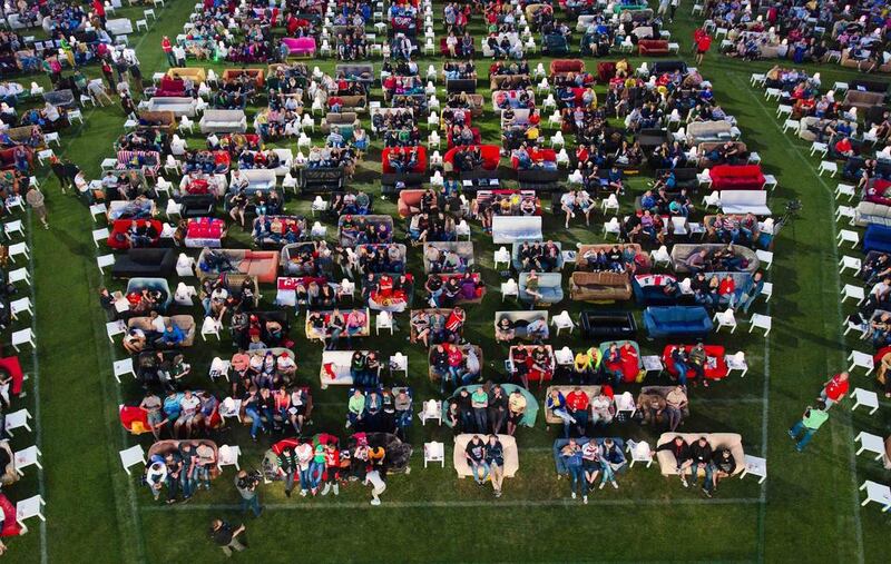 People sit on sofas as they watch the opening game of the 2014 World Cup between Brazil and Croatia at the Alte Forsterei stadium in Berlin, Germany. Thomas Peter / Reuters