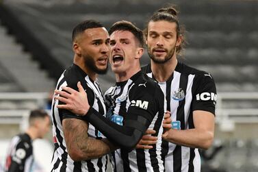 Newcastle United's Jamaal Lascelles celebrates scoring their late goal with Ciaran Clark and Andy Carroll. Reuters