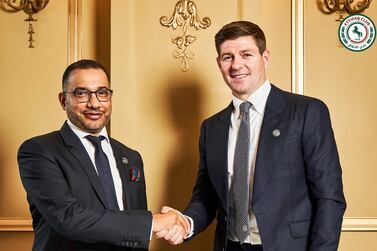 This handout picture released by Saudi Arabia's al-Ettifaq football club on July 3, 2023 shows Ettifaq's new English manager Steven Gerrard (R) with the club's President Khaled al-Debel after signing with them in London.  (Photo by Al Ettifaq Football Club  /  AFP)  /  == RESTRICTED TO EDITORIAL USE - MANDATORY CREDIT "AFP PHOTO  /  HO  / AL ETTIFAQ FOOTBALL CLUB" - NO MARKETING NO ADVERTISING CAMPAIGNS - DISTRIBUTED AS A SERVICE TO CLIENTS ==