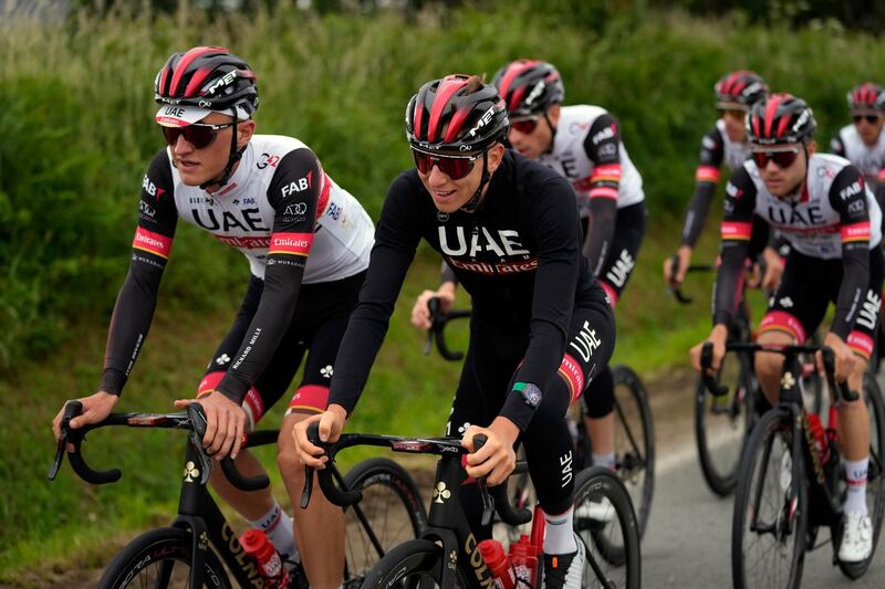 Slovenia's Tadej Pogacar center, rides with teammates during a training, outside Brest, western France, Thursday, June 24, 2021, ahead of Saturday's start of the Tour de France cycling race. (AP Photo/Daniel Cole)