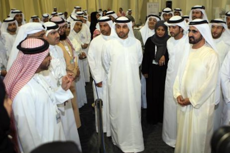 DUBAI - 24SEPT2011 -  Shaikh Mohammed bin Rashid al Maktoum, Vice President and Prime Minister of UAE interacts with candidates after casting his vote at Trade centre polling station yesterday in Dubai. Ravindranath K / The National