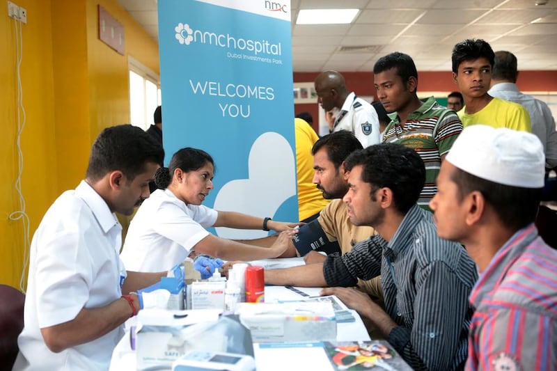 Labourers get blood tests at Dubai Industrial City on Friday. The campaign was hosted by the Pakistan Association of Dubai, and staff from local hospitals volunteered to carry out the tests. Christopher Pike / The National

