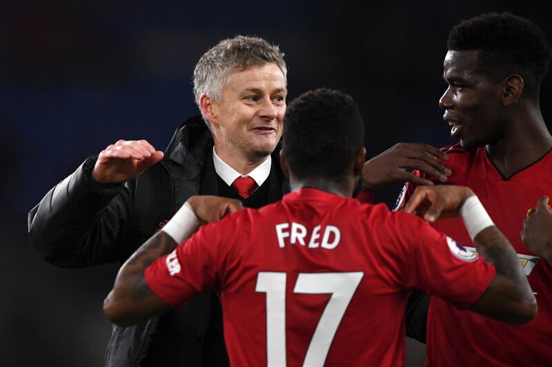 Solskjaer celebrates the result with his players. Getty