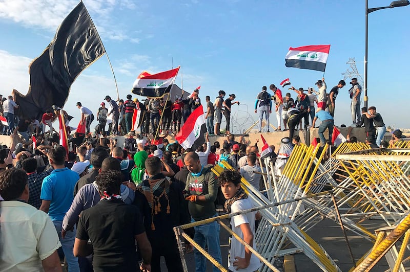 Protesters open the road leading to the Green Zone. AP Photo