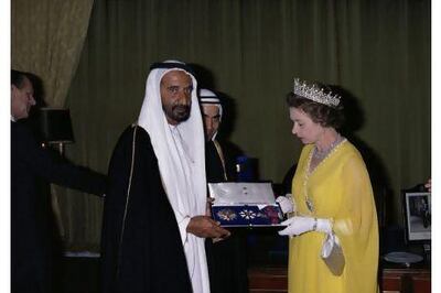 Sheikh Rashid bin Saeed is appointed a Knight Grand Cross of the Order of Saint Michael and Saint George by Queen Elizabeth in Abu Dhabi in February 1979 during her tour of the Gulf states.