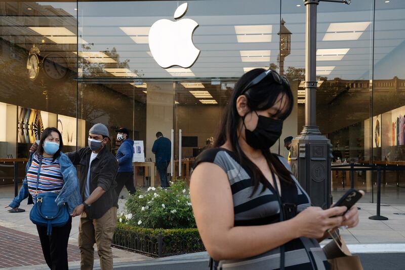 Shoppers wear protective masks outside an Apple Inc. store at the Americana at Brand shopping mall in Glendale, California, U.S., on Thursday, May 6, 2021. Los Angeles County and San Francisco County have reached a threshold to enter California’s most lenient yellow Covid-19 tier this week, setting the stage for the economy to be unshackled to the widest extent currently possible. Photographer: Bing Guan/Bloomberg