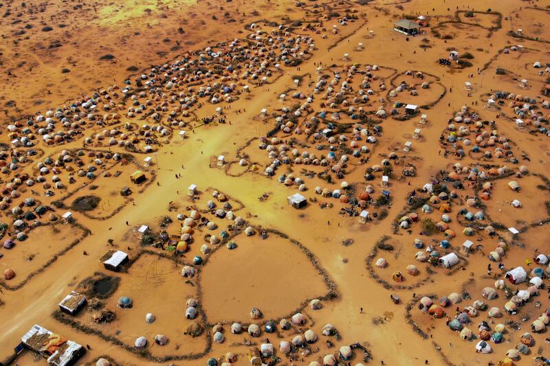 Huts made of branches and cloth provide shelter to Somalians displaced by drought on the outskirts of Dollow, Somalia. AP