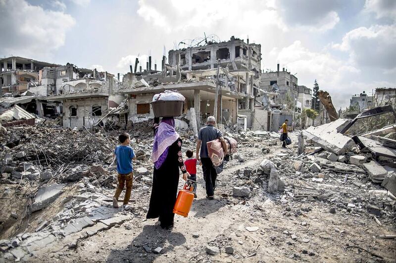 Gazan families who fled Israeli bombs in Beit Hanoun to seek refuge in UN shelters returned yesterday to find their homes reduced to rubble. Marco Longari / AFP

