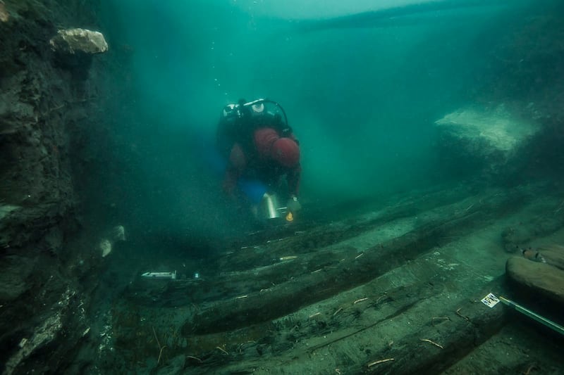 A diver examines the remains of an ancient military vessel discovered in the Mediterranean sunken city of Thonis-Heracleion off the coast of Alexandria, Egypt. Reuters