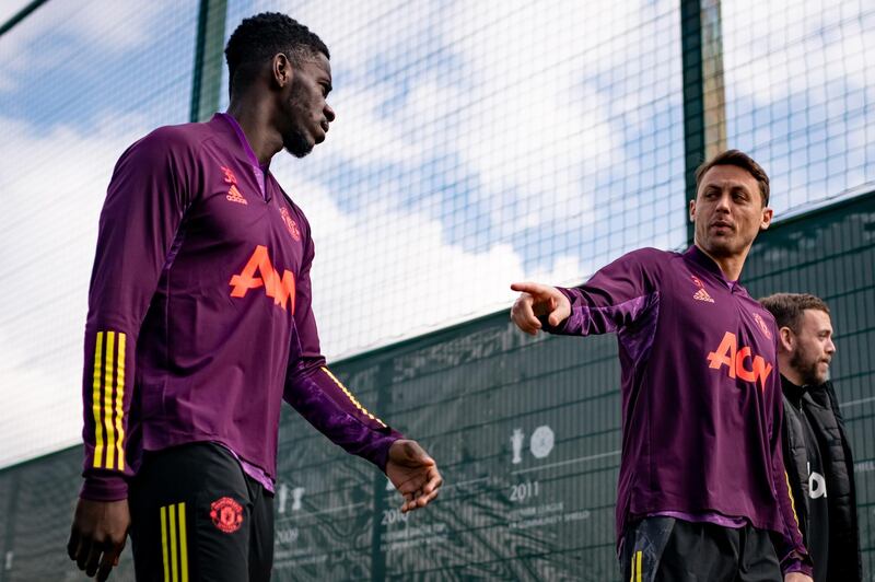 MANCHESTER, ENGLAND - APRIL 14: Axel Tuanzebe and Nemanja Matic of Manchester United in action during a first team training session at Aon Training Complex on April 14, 2021 in Manchester, England. (Photo by Ash Donelon/Manchester United via Getty Images)