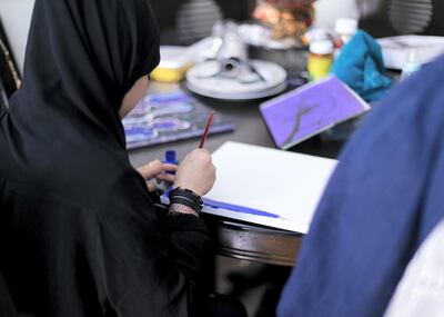 DUBAI, UNITED ARAB EMIRATES - JULY 9 2019.Fathima Azliya Hassan's daughter, SS, paints in her living room. SS and her three siblings have been have been living in the UAE for more than 20 years without visas, passports or any identity proof after they were abandoned by their Indian father. Photo by Reem Mohammed/The National)Reporter:Section: 