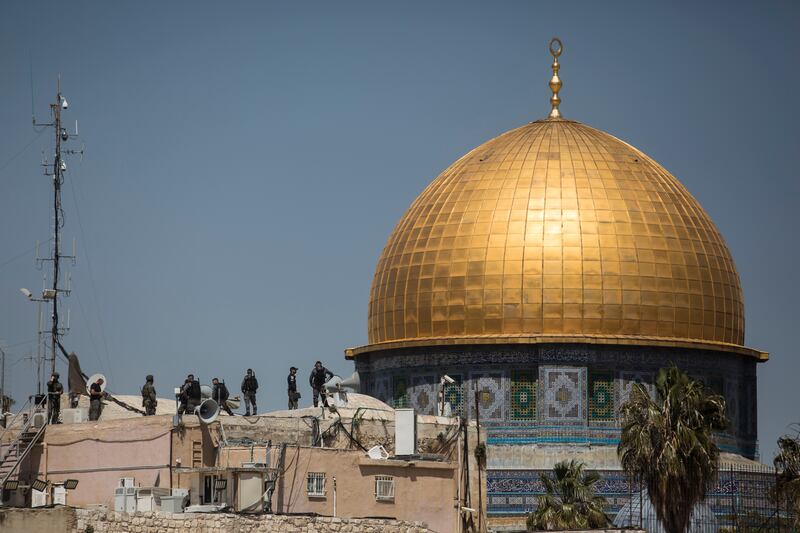 Israeli police officers keep watch after clashes with Muslim worshippers in Jerusalem. The overlapping religious occasions – Ramadan for Muslims, Passover for Jews and Easter for Christians – have increased tensions near contested sacred sites in Jerusalem. Getty Images