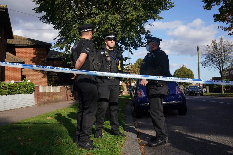 A police cordon was erected around the crime scene and armed officers were seen standing outside the church. AP