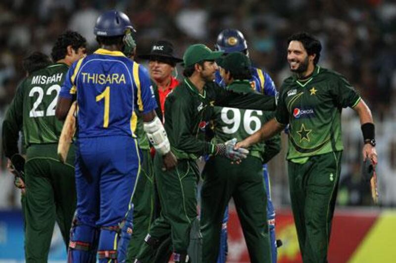 Shahid Afridi, right, made an impressive return to international cricket, which culminated in an all-round performance against Sri Lanka in Sharjah on Sunday. Afridi had retired following a spat with Ijaz Butt that resulted in his dismissal as captain of the limited-overs team.