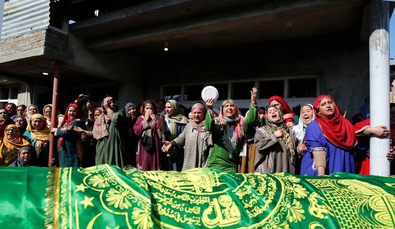 Women mourn at the funeral of Indian police officer Mohammad Altaf Najar, at Chadoora, in Indian Kashmir. EPA