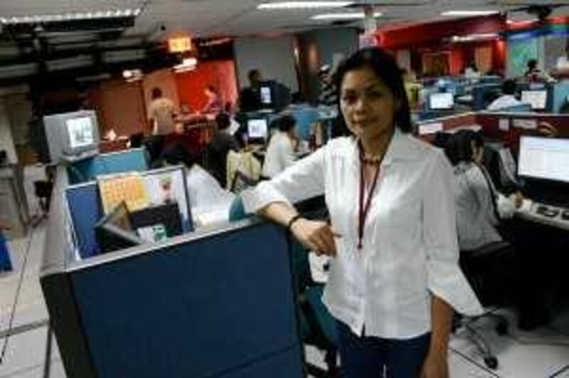 Glenda M. Gloria stands in the newsroom at ABS-CBN News Channel where she is chief operating officer. Like many journalists in the Philippines she has received death threats because of her reporting.

Credit: Jared Ferrie/The National *** Local Caption ***  Ferrie-JournalistKillings1.JPG