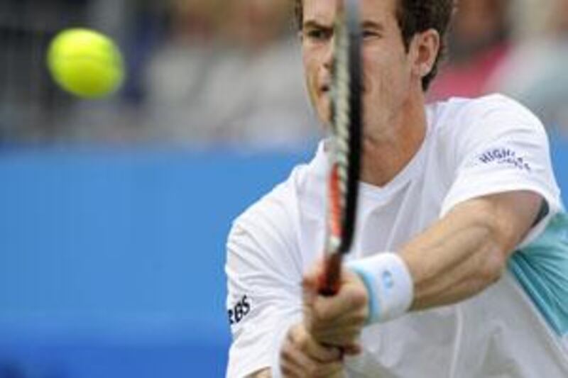 Britain's Andy Murray stretches for a backhand shot against Mardy Fish of the US during the quarter-final match at The AEGON Championships tennis tournament, at Queen's Club, in west London on June 12 2009. Murray won the match 7-5, 6-3.